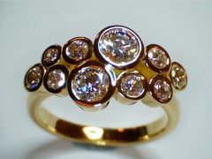 Custom-pge-18ct-yellow-gold-with-ten-bezel-set-diamonds.jpg
